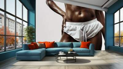 Close-up of a woman's toned, muscular, and sweaty torso, wearing white shorts, detailed and realistic Wall mural