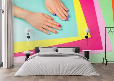 neon manicure on different multicolored neon backgrounds. flat lay style. Wall mural