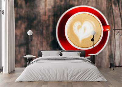 Red cup of cappucino with beautiful latte art Wall mural