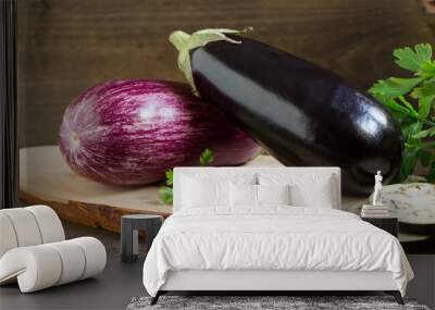 Two organic fresh eggplants on wooden background Wall mural