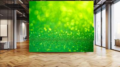 Green glitter christmas abstract background. Defocused sequin light. Wall mural