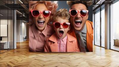 Happy emotionally fashionable family with the sun glasses. Family look. Wall mural