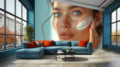 hydration. cream smear. beuaty close up portrait of young woman with a healthy glowing skin is apply Wall mural