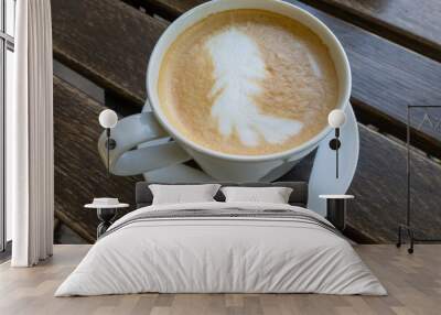 close up of white brown frothy foam in the hot cup of cappuccino. Softness of drink. Breakfast time in the morning at cafe. Coffee drink on wooden table, energy boost Wall mural