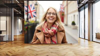 Joyful British lady with a big smile spreading happiness whereve Wall mural