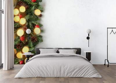 Chrismas background with fir branches and lights Wall mural