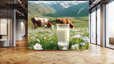 Milk in glass and cow on the background of mountain landscape Wall mural