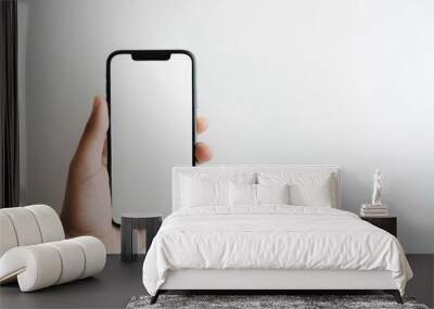 Minimalistic Smartphone in Hand with Blank Screen - Perfect for Mockups and Presentations Wall mural