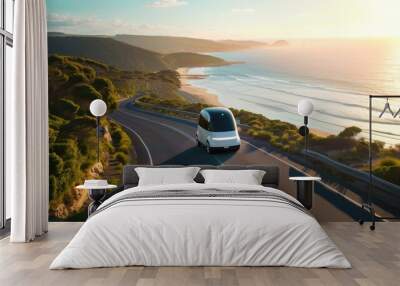 modern, eco-friendly autonomous pod travels along a scenic coastal road at sunset, showcasing the integration of advanced transportation with natural beauty Wall mural