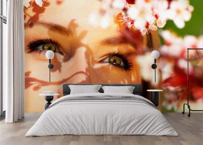 Young female face with flowers Wall mural