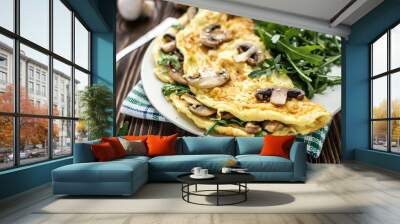 Omelette with mushrooms and arugula on a wooden background Wall mural