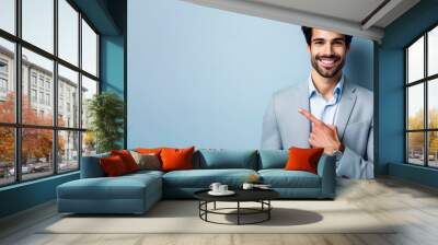 Portrait of cheerful businessman pointing at copy space for advertising against blue background. ai generative Wall mural