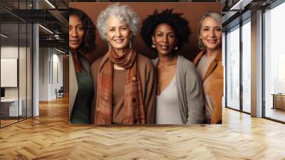 
Portrait of mixed age multiethnic women looking at camera isolated on brown background Wall mural