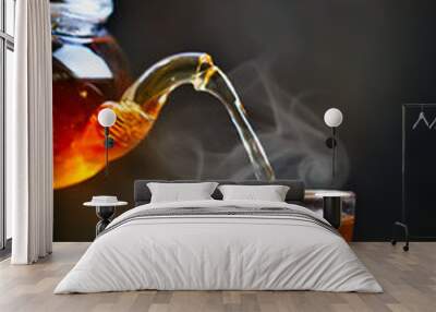 Process brewing tea,tea ceremony. Cup of freshly brewed black tea,warm soft light. Wall mural