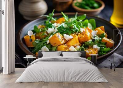 Pumpkin salad with arugula, feta cheese and pumpkin seeds Wall mural