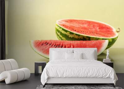 Juicy ripe fresh piece of watermelon. Summer pastel green background, side view Wall mural