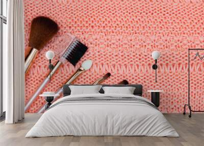 Set of professional make up brushes on pink background Wall mural