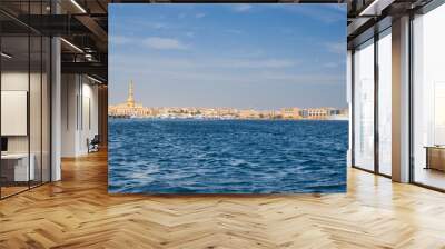 Panoramic view from the marina of Hurghada to the minarets of the El Mina mosque and the city's embankment with moored yachts, shops, cafes and a pedestrian zone for walking Wall mural