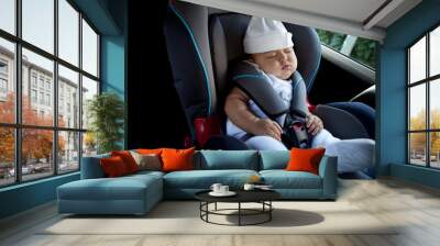 Sleep of the child in the car Wall mural