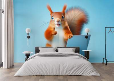 squirrel with laptop showing thumbs up on blue background Wall mural