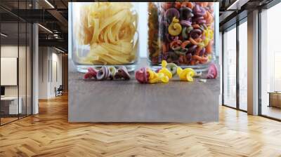 two jars of pasta on a wooden table Wall mural