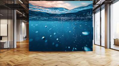 Underwater view with bubbles rising to the surface in a deep blue ocean. The image captures the serenity and mystery of the underwater world  Wall mural