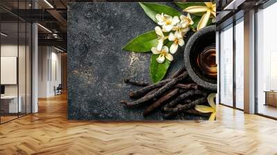 vanilla essential oil and mortar. Selective focus Wall mural