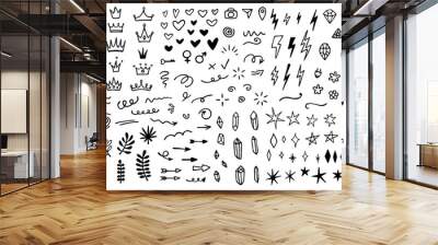 Vector set of different crowns, hearts, stars, crystals, sparkles, arrows, lightnings, diamonds, signs and symbols. Hand drawn, doodle elements isolated on white background. Wall mural