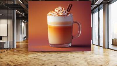 Warm-hued pumpkin spice latte in a glass cup garnished with cinnamon stick positioned artistically on a textured gradient background  Wall mural