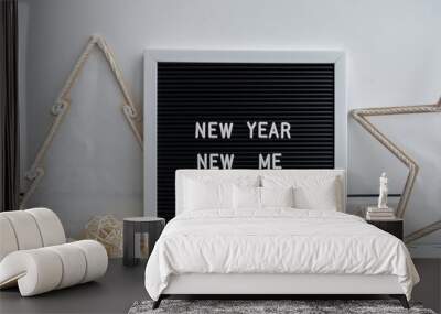 Letter board with inspirational message NEW YEAR NEW ME with natural zero waste homemade Christmas decor. Happy new year promises resolutions concept. Self growth and personal development Wall mural