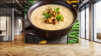 chanterelle cream soup on wooden background Wall mural