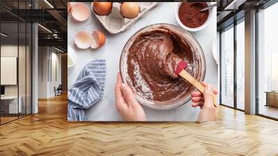 close up of female hands mixing ingredients in bowl. Baking chocolate cake Wall mural