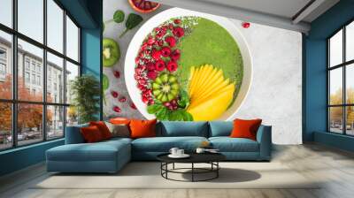 fresh green smoothie bowl with spinach, mango, kiwi and raspberry. Healthy vegan raw food Wall mural