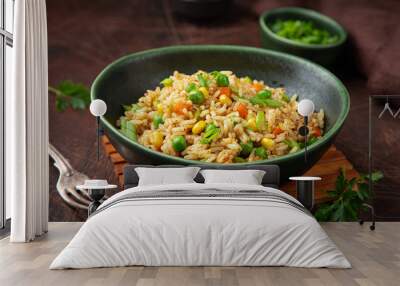 fried rice with vegetables in green bowl Wall mural