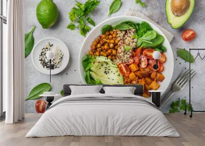 healhty vegan lunch bowl. Avocado, quinoa, sweet potato, tomato, spinach and chickpeas vegetables salad Wall mural