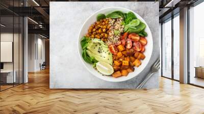 healhty vegan lunch bowl. Avocado, quinoa, sweet potato, tomato, spinach and chickpeas vegetables salad Wall mural