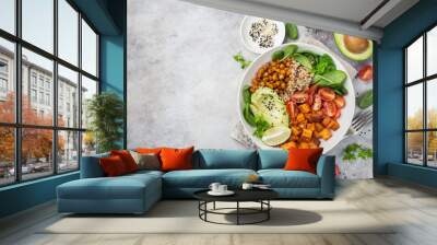 healhty vegan lunch bowl. Avocado, quinoa, sweet potato, tomato, spinach and chickpeas vegetables salad Wall mural