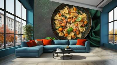 pumpkin farfalle pasta with pumpkin seeds and cheese in bowl Wall mural