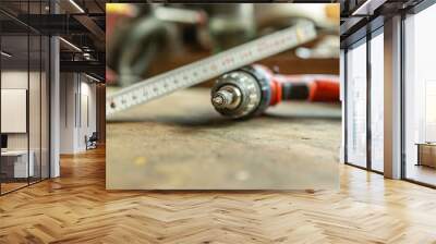 CLose-up of a cordless screwdriver on workbench Wall mural