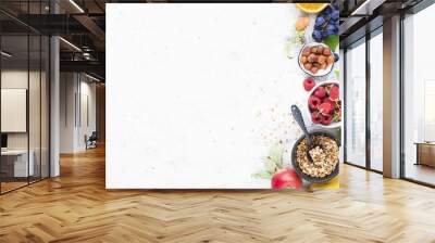 ingredients for healthy breakfast meals: raspberries, blueberries, nuts, orange, bananas, grapes blu Wall mural