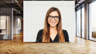 Close up portrait of beautiful young businesswoman wearing eyeglasses Wall mural