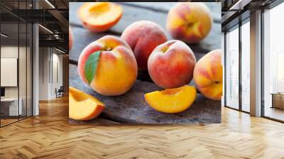 Fresh peaches, fruits on grey wooden background. Close up. Wall mural