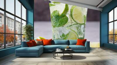 Mojito cocktail with lime and mint in highball glass on a grey stone background Wall mural