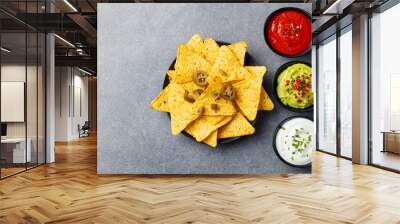 Nachos chips with dip variety. Copy space. Wall mural