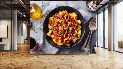 Pasta fettuccine with beef ragout sauce in black bowl. Grey background. Close up. Top view. Wall mural