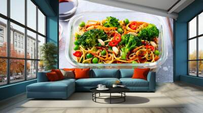 Stir fry noodles, udon with vegetables in lunch box. Grey stone background. Close up. Wall mural