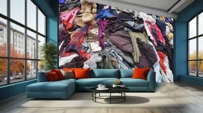 large pile stack of textile fabric clothes and shoes. concept of recycling, up cycling, awareness to global climate change, fashion industry pollution, sustainability, reuse of garment Wall mural