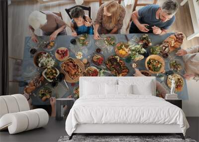 High angle view of big family sitting at the table and having dinner together at home Wall mural