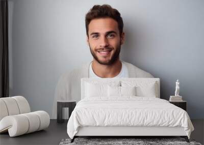 medium shot portrait of a confident Israeli man in his 20s wearing a chic cardigan against a minimalist or empty room background Wall mural