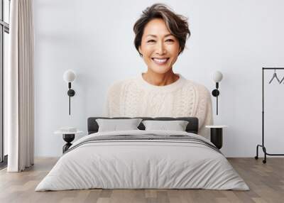 Portrait of a Filipino woman in her 40s wearing a cozy sweater against a white background Wall mural